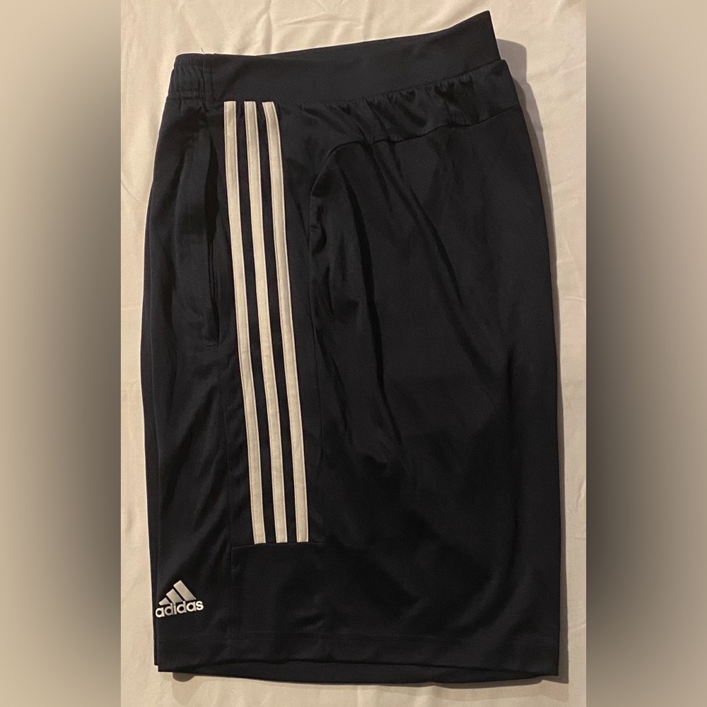 adidas navy  blue and white stripes with zippered pockets on  100% Polyester
